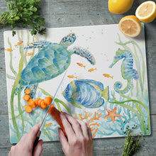 Load image into Gallery viewer, CounterArt Sea Life Serenade Tempered Glass Counter Saver Cutting Board Made in the USA 15 inch by 12 inch
