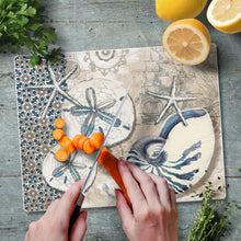 Load image into Gallery viewer, CounterArt Tide Pool Shells Tempered Glass Counter Saver/Cutting Board 10” by 8” Made in the USA
